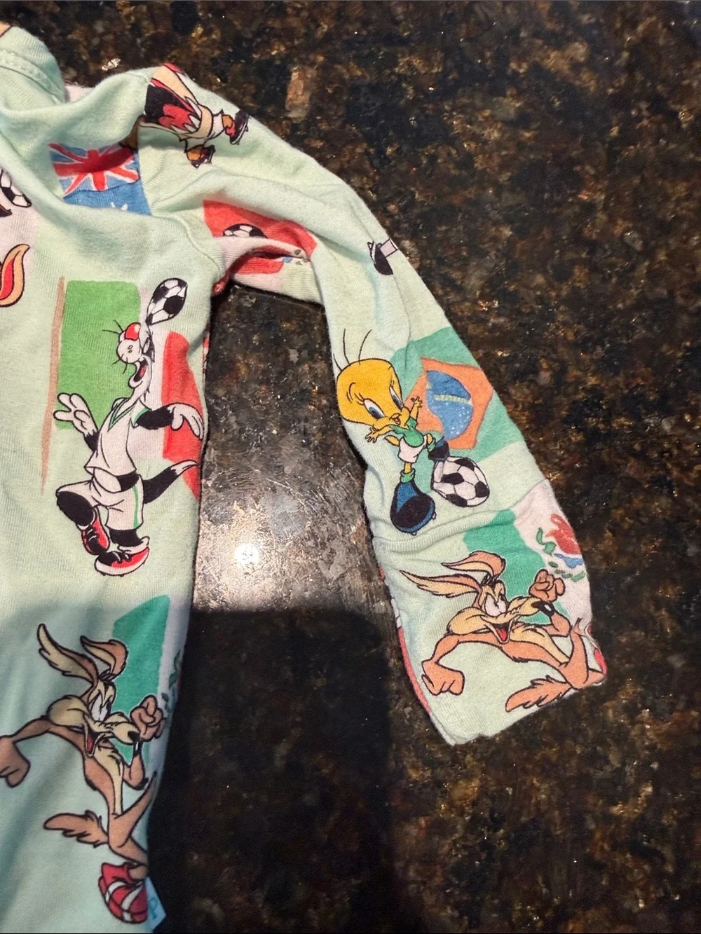 Posh Peanut Light Green Soccer Looney Toon Character Footed One-Piece Newborn